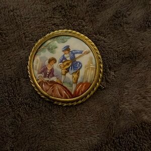 Porceline painted brooch (signed)